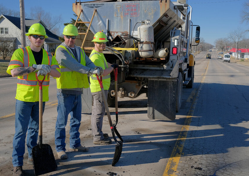 MoDOT employees Josh Girard, Adam Dove and Taylor Batman save Sedalia citizens by filling East Broadway Boulevard potholes with cold-mix tar Tuesday, Jan. 30. Broadway became full of potholes over the last few weeks due to recent winter storms bringing snow, ice and below-freezing temperatures. The Missouri Department of Transportation maintains Highways 50 and 65 in Pettis County, while other county and local roads fall to the responsibility of the City of Sedalia or Pettis County. To report road issues, residents can visit modot.org/report-road-concern for MoDOT, visit pettiscomo.com/highway for Pettis County, or call 660-827-7820 for Sedalia.   Photo by Chris Howell | Democrat