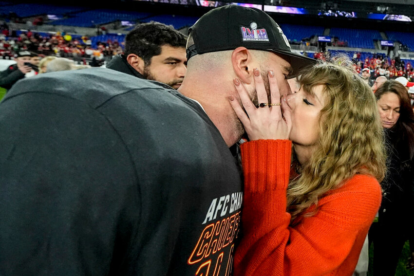 Taylor Swift kisses Kansas City Chiefs tight end Travis Kelce after an AFC Championship NFL football game against the Baltimore Ravens, Sunday, Jan. 28, 2024, in Baltimore. The Kansas City Chiefs won 17-10.   PhotoCredit: Photo by Julio Cortez | AP Photo