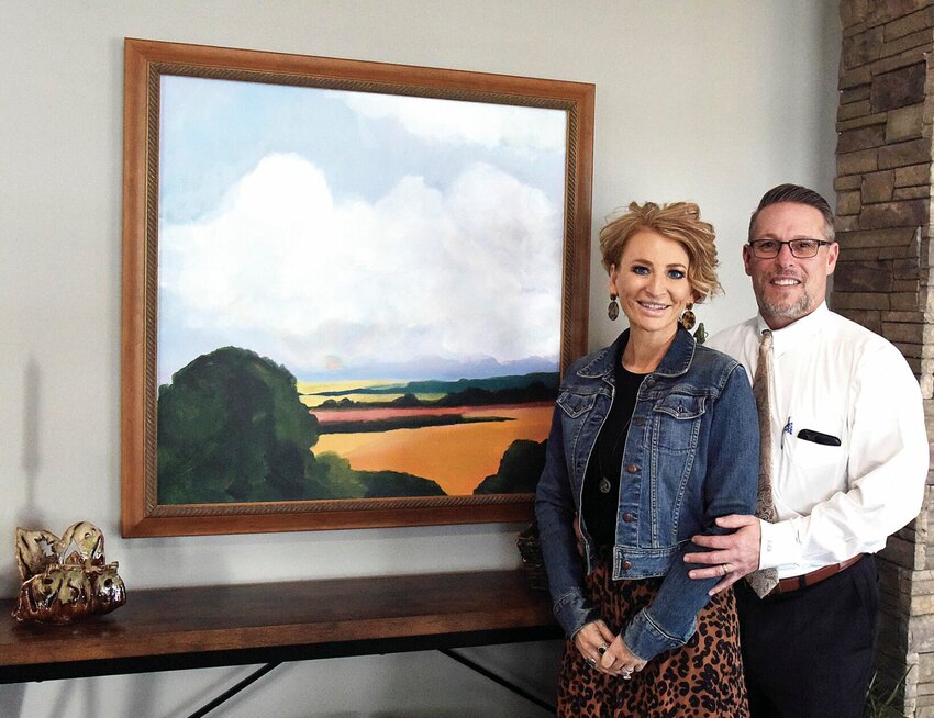 On Wednesday, Feb. 7, Brad and Sarah Rea stand in the new Rea Funeral Chapel and Cremation Services foyer. They will host an open house from 10 a.m. to 2 p.m. Saturday, Feb. 10, at the new facility, 3510 W. 16th St.   Photo by Faith Bemiss-McKinney | Democrat
