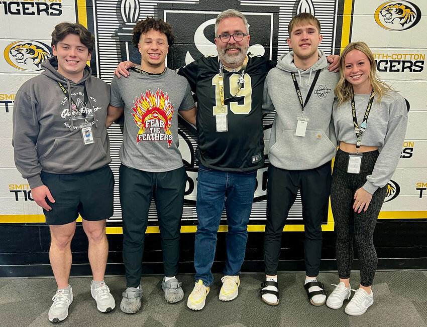Smith-Cotton High DECA seniors Alex Rice, left, and Mylan Hawkins, second from left, led S-C's school store, The Tiger Tailgate, to its third DECA recertification in the Gold category for Food Operations. Fellow Smith-Cotton DECA seniors Brady Anderson, second from right, and Marianne Treuner, right, earned a first-time Gold certification in the Retail Operation category for the S-C clothing shop, Tiger Threads. Both duos now are headed to DECA Nationals in Anaheim, Calif., in April. They are shown with S-C High Principal Wade Norton. S-C's DECA advisor is Kassie Eddy.   Photo courtesy of Sedalia School District 200