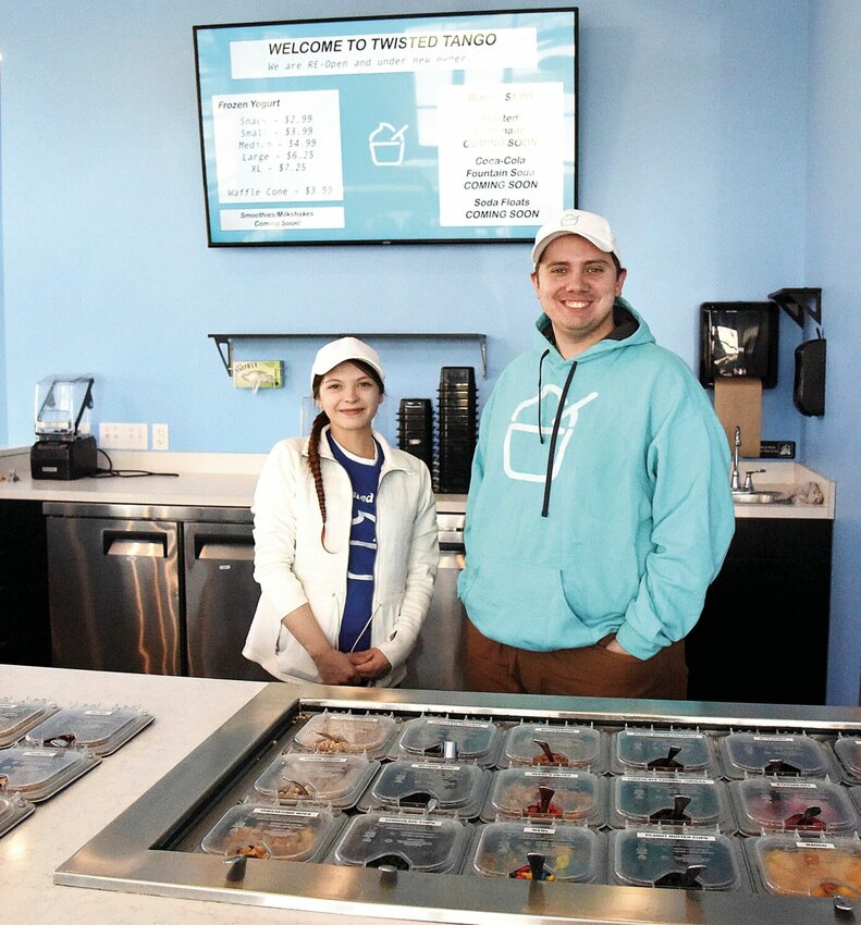 On Monday, Feb. 12, at Twisted Tango Frozen Yogurt, Jacob Carver, co-owner, and Natasha Parkhurst, a server, stand in the newly opened shop. Carver owns the business with Shane Graeser; the men reopened the shop on Winchester Drive on Monday, Feb. 5.   Photo by Faith Bemiss-McKinney | Democrat