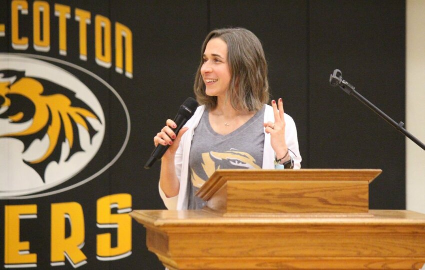 Katie Meehan Hauser, a Class of 1999 graduate, speaks at the induction ceremony for the Smith-Cotton Athletics Hall of Fame between Friday night's boys' and girls' varsity basketball contests.   PhotoCredit: Photo by Bryan Everson | Democrat