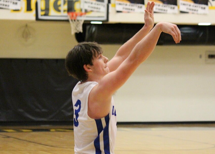Cole Camp senior Grady Strathman shoots a 3-pointer in a Kaysinger Conference Tournament game at Smith-Cotton High School on Jan. 27. Strathman and the Bluebirds&nbsp;open up the postseason on Tuesday against Warsaw at the Stover Dome.   PhotoCredit: Photo by Bryan Everson | Democrat