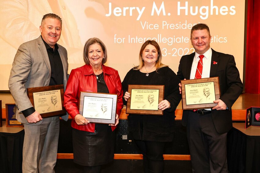 Members of the Hughes family pose with a photo with plaques honoring Jerry Hughes' induction to the UCM Athletics Hall of Fame Induction on Saturday, Feb. 17.&nbsp;   Photo courtesy of Andrew Mather Photography