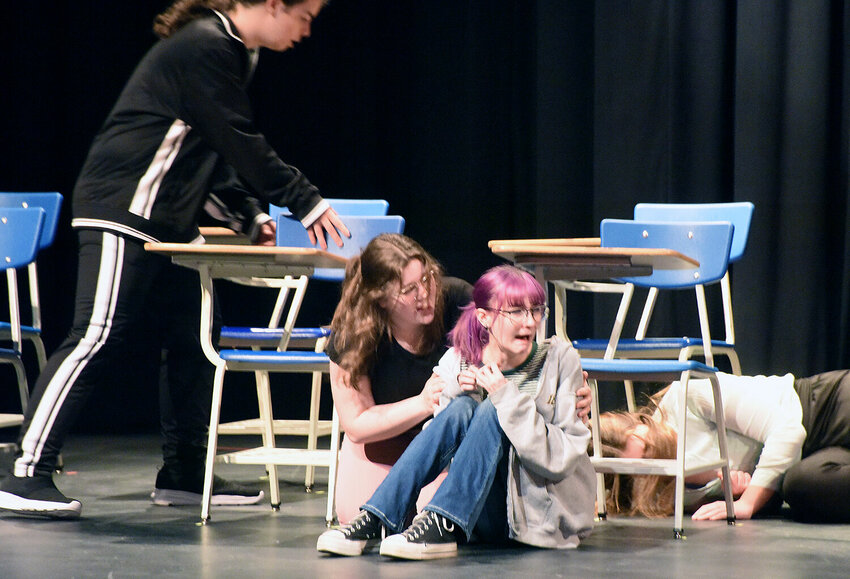 Smith-Cotton High School theatre students hit the floor during dress rehearsal Tuesday night, Feb. 27 for the one-act play, &quot;Lockdown.&quot; S-C students, from left, are Tucker Johnson, Maddison Medlock, Emma Gray, and Elinor Beard.&nbsp;The play is the annual presentation of Theatre for a Cause, with proceeds going to Child Safe of Central Missouri.&nbsp;   Photo by Faith Bemiss-McKinney | Democrat