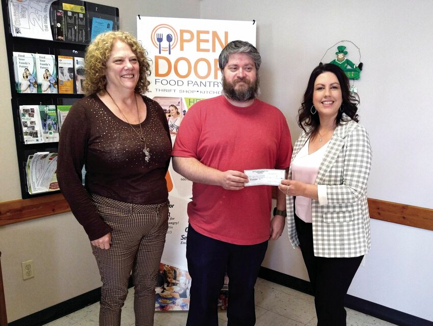 Immanuel United Church of Christ recently donated $1,055 to Open Door Service Center. The funds were raised through the annual Souper Bowl soup drive. Pictured from left are Open Door Director of Development Michelle O'Donnell, Executive Director Amanda Davis, and William Gerlt of Immanuel Church.   Photo courtesy of William Gerlt