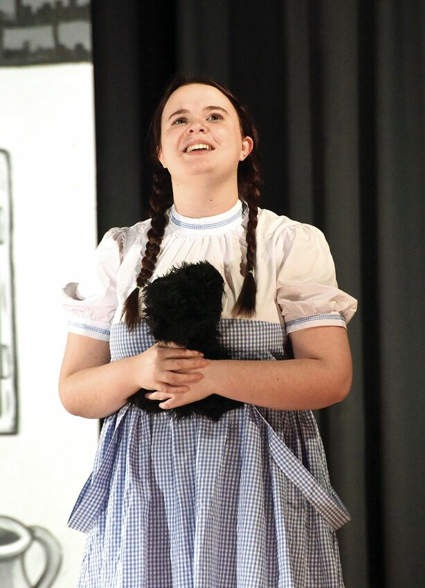 Thursday, Feb. 29, during rehearsal for the musical &ldquo;The Wizard of Oz,&rdquo; Smithton R-VI student Izzy Brown, who portrays Dorothy, sings the classic song &ldquo;Somewhere Over the Rainbow.&rdquo; Smithton students from grades three through 12 will present the musical on March 8 and 9.   Photo by Faith Bemiss-McKinney | Democrat