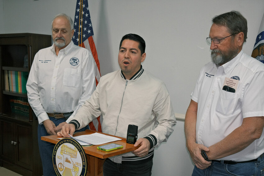 Pettis County Commissioners, from left, Jim Marcum, Israel Baeza and Bill Taylor host a press conference Friday afternoon, March 1 to pledge up to $200,000 to help the City of Sedalia replace the now-closed Washington Avenue bridge.   Photo by Chris Howell | Democrat