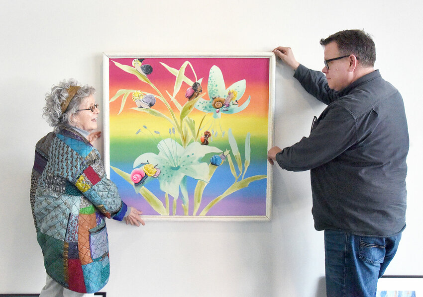Wednesday, March 6, Liberty Center Association for the Arts Gallery Committee member Vicki Weaver and Sedalia Visual Art Association President Dustin Schmidt hang a piece for the upcoming Spring Fling Juried Group Show. The piece &quot;Snails&quot; is by Haylea Heimsoth, of Sedalia.   Photo by Faith Bemiss-McKinney | Democrat