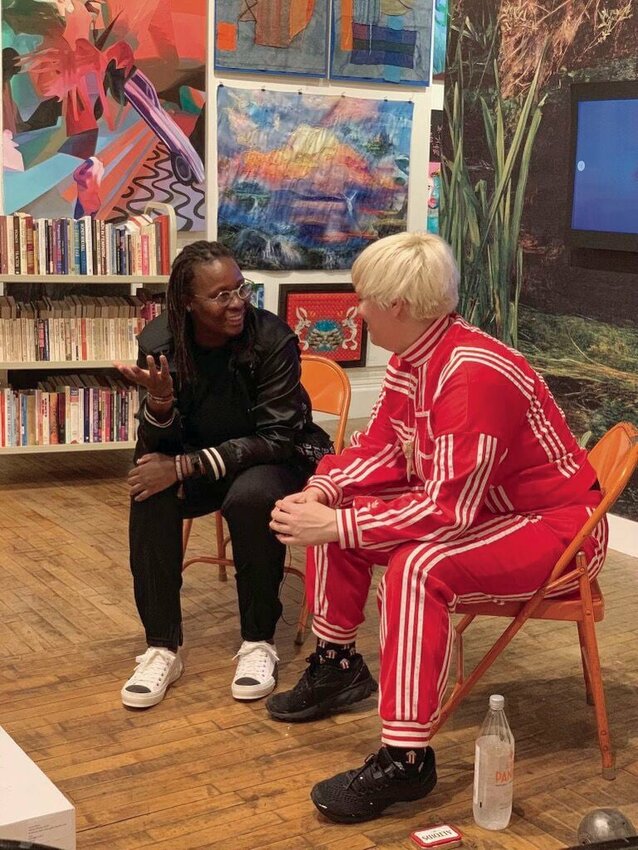 Sedalia artist C. Finely, founder of the Every Woman Biennial in New York City, talks with an artist in New York recently.&nbsp;   Photo courtesy of C. Finley