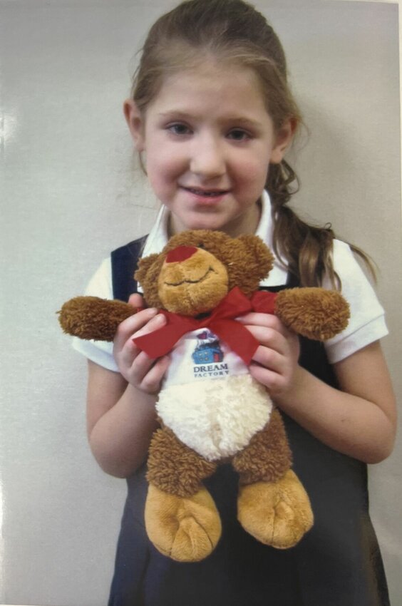 Caroline Wilson holding her new Dream Factory teddy bear.   Photo courtesy of The Sedalia Area Dream Factory.
