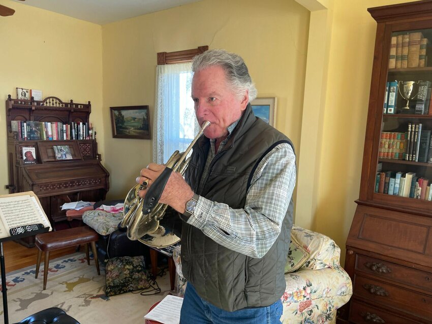 French horn player Bill Lane demonstrates how to play the introduction to the show &ldquo;Little House on the Prairie&rdquo; on Thursday, Feb. 15, in Knob Noster.   Photo by Zach Bott | Star-Journal