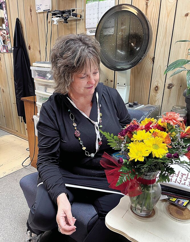 On Thursday, March 7, Sedalia hairdresser Jennifer Ramey receives a bouquet from a friend, Kathy Peterson, to celebrate her 30 years of owning the Park Avenue Salon.


Photo by Faith Bemiss-McKinney | Democrat