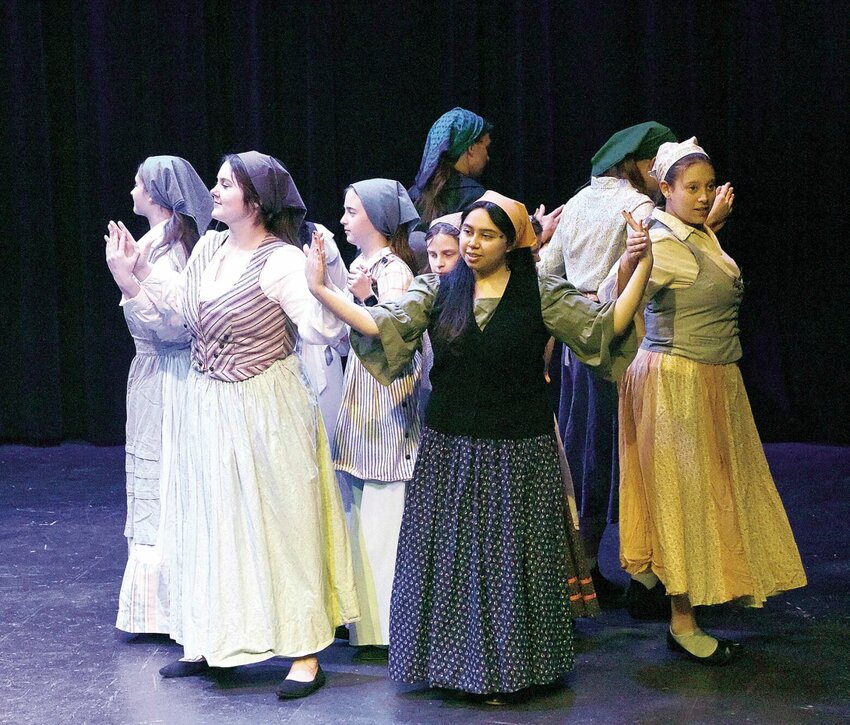 On Tuesday, March 19, Sacred Heart theatre students, from left, Mary Butner, Laysha Lopez, and Sofia Guevara dance in a rehearsal scene of &quot;Fiddler on the Roof.&quot; The musical will be presented at 7 p.m. Friday, March 22 and Saturday, March 23 at the Hayden Liberty Center.   Photo by Faith Bemiss-McKinney | Democrat