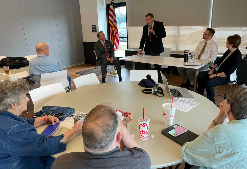 The Pettis County Pachyderm Club hosted a candidate forum Friday, March 22 at the Heckart Community Center. Moderator Kevin Lujin, far left, asked questions of candidates, from left, Steve Bloess (standing), Jeff Page and Patty Wood.   Photo by Chris Howell | Democrat