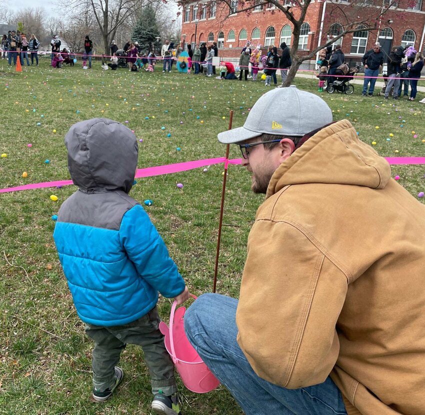 Simon Miller gets last minute instruction on Easter egg hunting from his father, Lance, Saturday, March 23 at the Liberty Park Easter egg hunt. The horn at 10 a.m. sharp sent kids scrambling.   Photo by Chris Howell | Democrat
