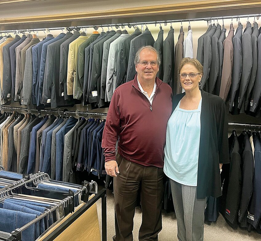 Ken and Carol Weller, owners of Weller's Men's Wear, stand in the shop on Monday, April 1. The shop, which has been in business for 74 years, will close at the end of May.   Photo by Faith Bemiss-McKinney | Democrat
