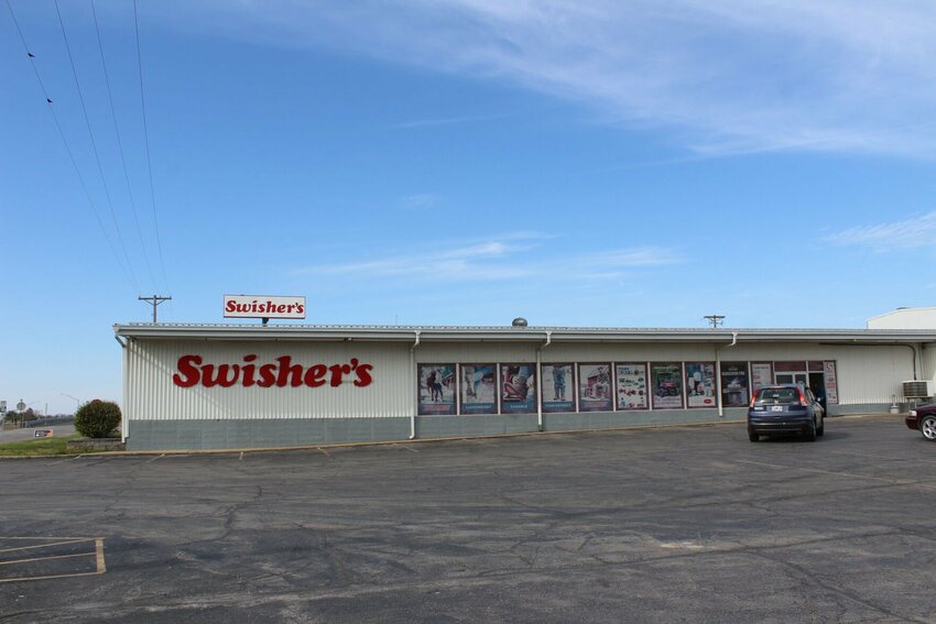 A car pulls in to park at the storefront of Swisher's on Friday, March 29 in Warrensburg.&nbsp;First opened in 1965 by Ray Swisher and his business partner Louis &ldquo;Louie&rdquo; Feldman, the store was then called Louie&rsquo;s Farm &amp;amp; Home.   Photo by Zach Bott | Warrensburg Star-Journal