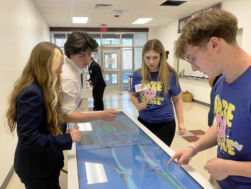 Smith-Cotton High HOSA students, from left, Jacelyn Lancaster, Jeffthan Glaster, Samantha Hagedorn and Calvin Brewer compete in the statewide HOSA Anatomage Tournament, where they captured first place.   Photo courtesy of Sedalia School District 200