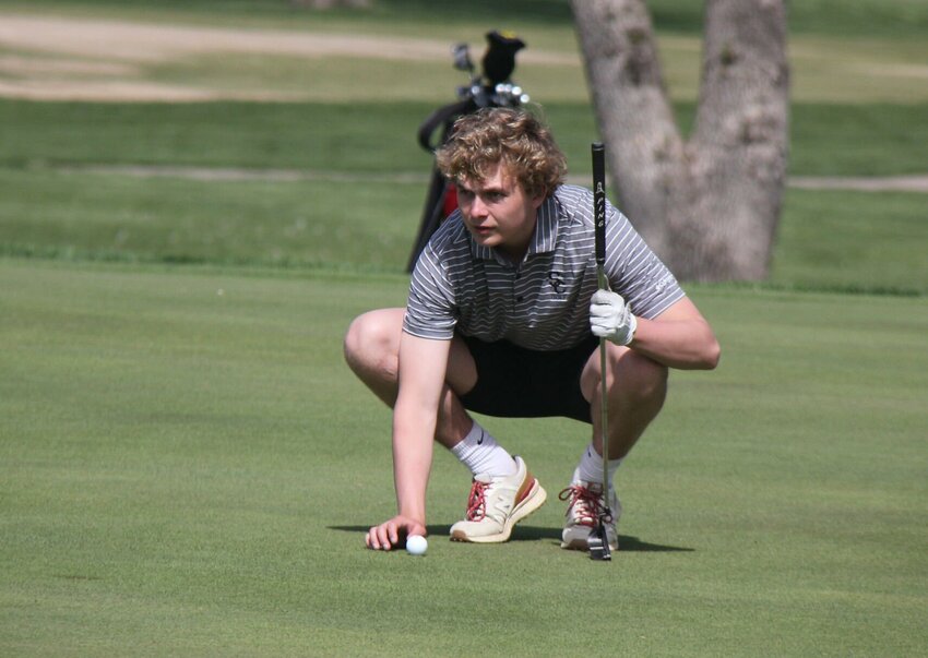 Smith-Cotton senior Findlay Hume lines up his putt during the Smith-Cotton Classic golf tournament Monday at Sedalia Country Club. Hume shot an 86 on the day.   Photo by Jack Denebeim | Democrat