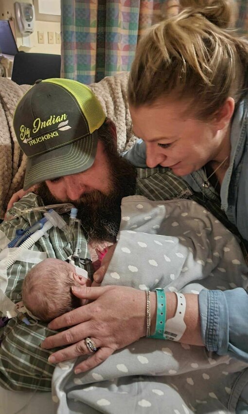 Jay and Lynn Hurt, formerly of Sedalia, hold their son Harrison Dean Hurt, born Dec. 11, 2023. Harrison was born with several health issues. A benefit for the family is slated for Saturday, April 13, at the Pork House.   Photo courtesy of Jay and Lynn Hurt
