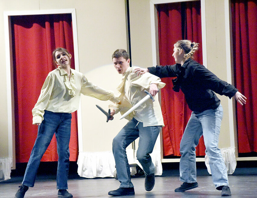 Smith-Cotton High School students, from left, Kiana Benfield-Boik, Aiden Rohr, and Samantha Hagedorn perform the &quot;Romeo and Juliet&quot; prologue Thursday, April 11, during a dress rehearsal for &quot;The Complete Works of William Shakespeare (Abridged).&quot; Students will present the play at 7 p.m. Friday, April 12, and Saturday, April 13.   Photo by Faith Bemiss-McKinney | Democrat