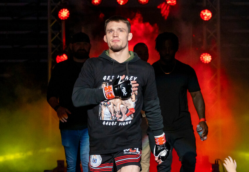 MMA fighter Gauge Young walks to the cage ahead of his fight against Brexton Everett at the Fighting Alliance Championship 22 on Dec. 1 at Cable Dahmer Arena in Independence. Young is 7-1 in his professional fighting career.   Photo by Chuck Williams Photography | Photo courtesy of Ed Kapp