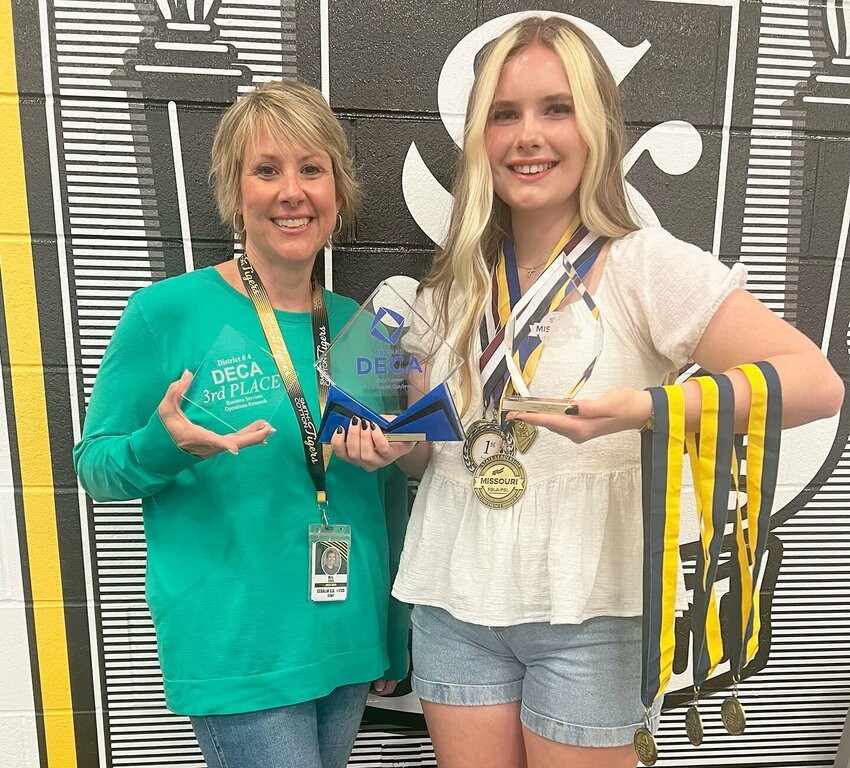 Smith-Cotton High School senior Jacelyn Lancaster, right, gets help from Senior Class Counselor Katie Ellis to show off awards she has won this school year in DECA, FBLA and HOSA competitions.


Photo courtesy of Sedalia School District 200