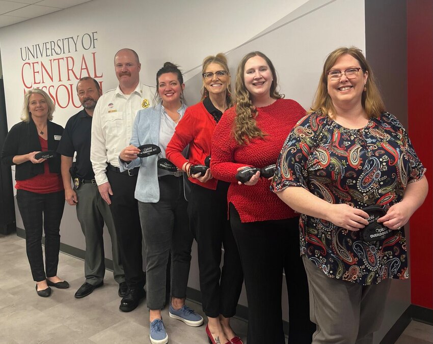 From right, Dr. Amy Kiger, Kourtney Dutton, Dr. Crissy Hall (UCM), City Manager Danielle Dulin, Fire Chief Ken Jennings, Capt. Dan Othic (UCM), and City Clerk Jodi Schneider pose for a picture sporting Naloxone kits.&nbsp;   Photo courtesy of the Warrensburg Fire Department