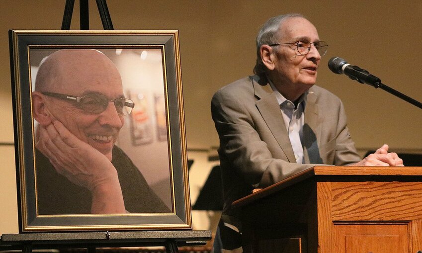 Tony Walch addresses the audience at the induction of his younger brother, Ted Walch, into the Smith-Cotton Activities Hall of Fame on Tuesday, April 30, in the Heckart Performing Arts Center. Ted Walch, who died in 2022, was a theater teacher for more than 30 years.   Photo courtesy of Sedalia School District 200