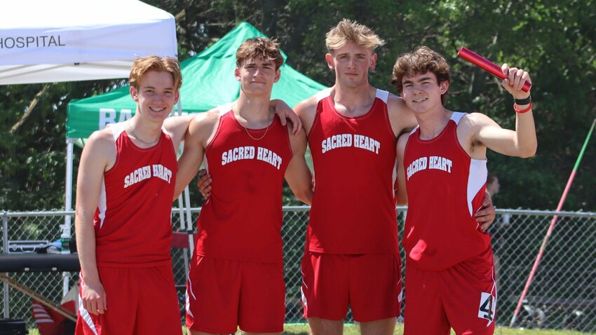 The Sacred Heart 4x800-meter relay team, from left to right, sophomores Logan Howell, Max Van Leer, Jared Owens and senior Jackson Manning, celebrates its sectional championship at Adrian High School Saturday, May 11. The Gremlins placed first with a time of 8:44.69 to qualify for state.   Photo courtesy of Carrie Smith