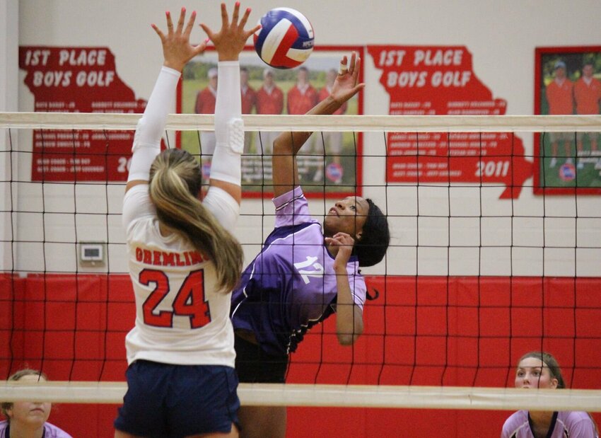 Green Ridge senior Nevaeh Washington prepares a right-handed strike in Thursday night's match against Sacred Heart. The Lady Tigers won in four sets.   Photo Credit: Photo by Bryan Everson | Democrat