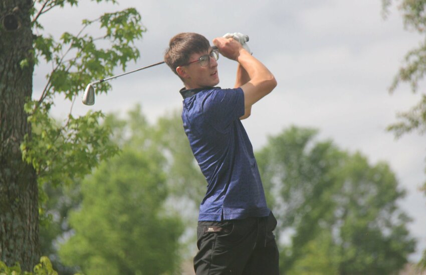 Green Ridge senior Sam Verbovshchuk hits his shot toward the green at the Class 1 District 3 golf tournament in Clinton on May 6. Verbovshchuk sits in second place after shooting a 74 (+2) during Round 1 of the Class 1 Golf Tournament Monday, May 13.   File photo by Jack Denebeim | Democrat