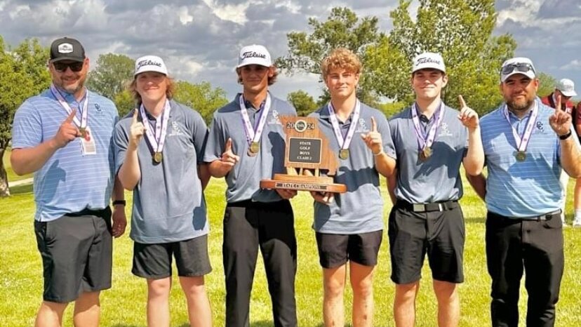 The Cole Camp boys golf team, from left to right, head coach Jared Espey, junior Gage Oelrichs, senior Matthew Bright, senior Tyler Howard, junior Spencer Godwin and assistant coach Luke Heisterberg, celebrate winning the Class 2 State Golf Championship Tuesday, May 14, at Paradise Pointe Golf Complex in Smithville. The team came back from fifth place in Round 1 to win the title after shooting a two-day score of 677.   Photo courtesy of Jared Espey, Cole Camp Athletics