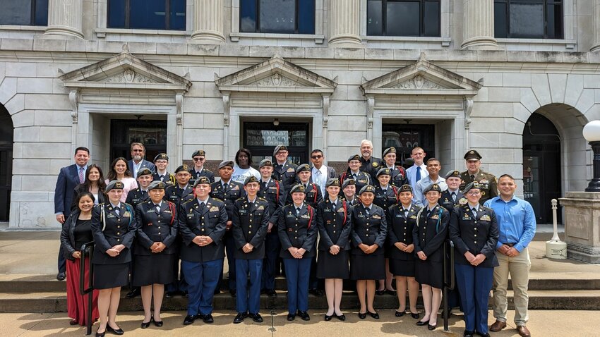 The Pettis County commissioners pose for a photo with the Smith-Cotton JROTC Tiger Battalion members and instructors outside the Pettis County Courthouse.   Photo courtesy of the Pettis County Commission
