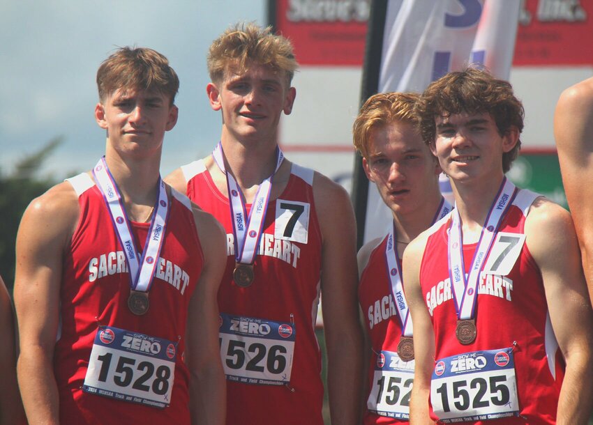 The Sacred Heart 4x800-meter relay team, from left to right, sophomore Max Van Leer, sophomore Jared Owens, sophomore Logan Howell and senior Jackson Manning, celebrate placing third at the MSHSAA Class 1-3 State Track and Field Meet at Jefferson City High School Friday, May 17. The Gremlins finished with a school record time of 8:23.06.   Photo by Jack Denebeim | Democrat