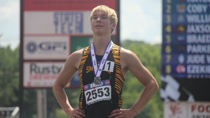 Smithton sophomore Coby Tagtmeyer celebrates earning his first individual state medal after he placed second in the Class 2 boys 800m run Saturday, May 18, during the MSHSAA Class 1-3 State Track and Field Meet in Jefferson City. Tagtmeyer ran a personal-best time of 1:59.60.   Photo by Jack Denebeim | Democrat