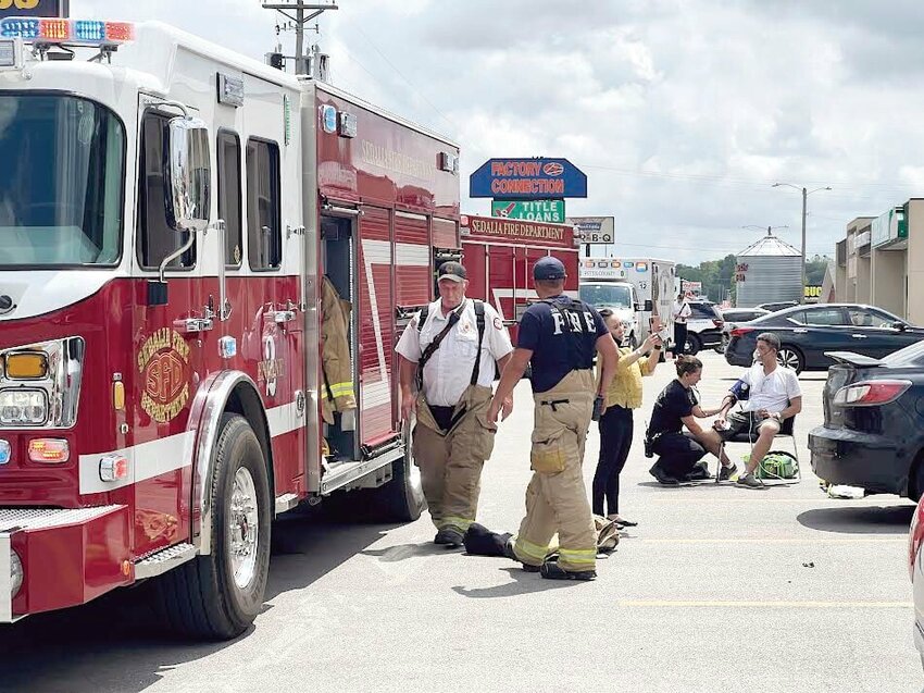 Members of the Sedalia Fire Department respond to a fire at Bella Nails & Spa on West Broadway Boulevard as an employee is treated for smoke inhalation Thursday afternoon, May 23.


Photo by Faith Bemiss-McKinney | Democrat