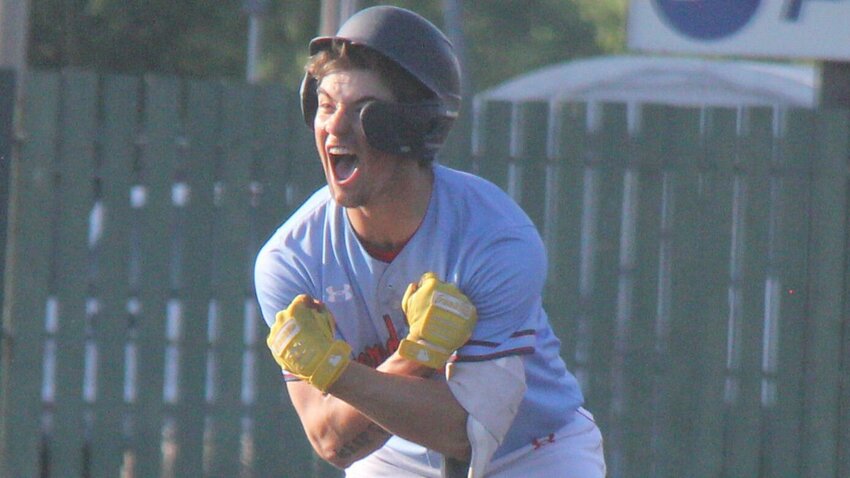 Senior Gavin Caldwell lets out a celebratory scream towards the Sacred Heart dugout after hitting a go-ahead double during the Class 1 sectional game against St. Elizabeth Monday, May 20.   Photo by Jack Denebeim | Democrat