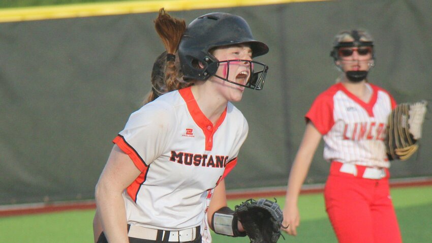 Northwest senior Karli Smith lets out a celebratory scream toward the Mustangs dugout after hitting a triple in the Class 1 District 7 championship game against Lincoln on May 8. Smith was one of six players to represent Northwest on the recently announced All-Kaysinger Conference first team roster.   File photo by Jack Denebeim | Democrat
