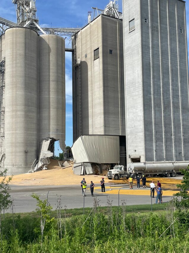 The Tyson feed mill in Dresden suffered unexplained damage Friday evening, June 7, forcing emergency crews to create a dam of soybean meal to contain an unknown liquid from leaking into the groundwater. Unknown tons of corn spilled from the silo through gaping holes. The feed mill is closed as industrial engineers assess safety of the facility.   Photo by Chris Howell | Democrat