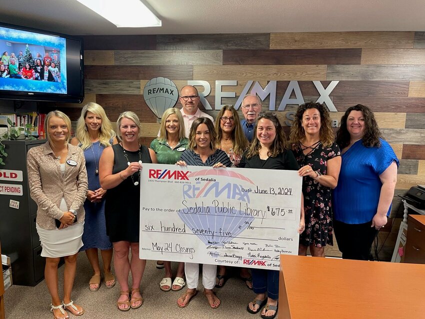 RE/MAX of Sedalia recently donated $675 to the Sedalia Public Library through its Heart of Sedalia Foundation. Each month, the agents donate a portion of their earnings from every transaction to help support various local charities.   Photo courtesy of RE/MAX of Sedalia