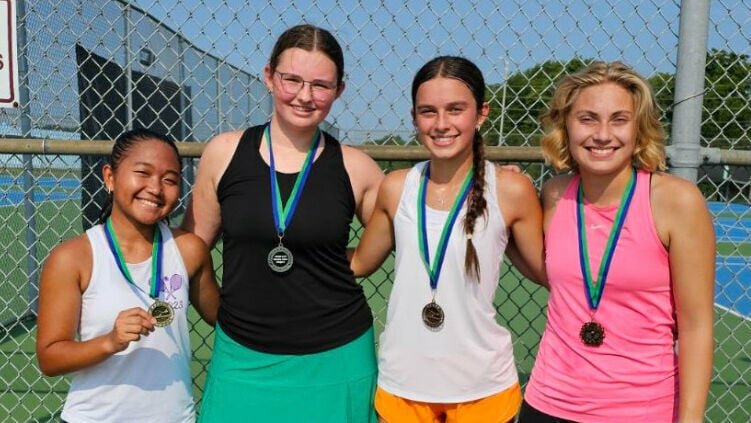 Natalie Beard, second from left, celebrates placing second in the varsity girls singles tournament of the Jaguar Slam series at the KC Summer Slam Thursday, July 25. Also pictured are North Kansas City&rsquo;s Angel Denopol, farthest left, St. Pius&rsquo; Kiera Dunn, second from right, and Grain Valley&rsquo;s Cate Barnes.   Photo courtesy of KC Summer Slam