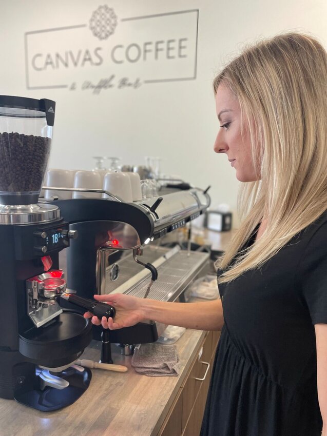 Stephanie Holem brews a wonderful latte at Canvas Coffee and Waffle Bar, after recently renovating the space and buying the finest equipment. Photo by Chris Howell | Democrat