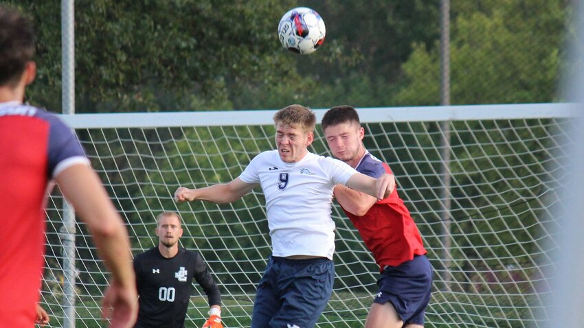 State Fair Community College sophomore Ethan Phillips heads a ball during a game against Jefferson City Community College last season. Phillips is one of seven sophomores returning to the Roadrunners soccer team this season.   File photo by Bryan Everson | Democrat
