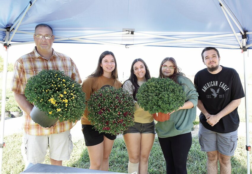 On Thursday, Sept. 5, from left, State Fair Community College Horticulture students Timmothy Garrigus, Lilie Lett, Sylvia Miller, Elizabeth Ratliff, and Cody Brandt pose for a photo behind the college&rsquo;s greenhouse. The annual SFCC Ag Club Mum Sale is in full swing, with proceeds going toward Ag-related trips and contests for Ag and Horticulture students.   Photo by Faith Bemiss-McKinney | Democrat