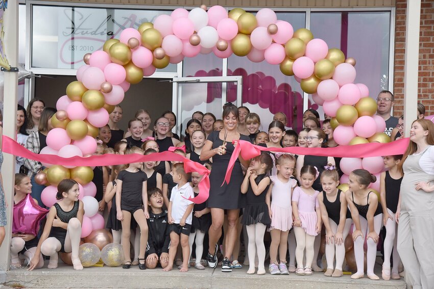 Anna Crumley Nelson, owner and director of Studio A Dance Conservancy, cuts the ribbon on the studio's new facility on Saturday, Sept. 14, iin the Thompson Hills


Shopping Center Photo by Faith Bemiss-McKinney | Special to the Democrat