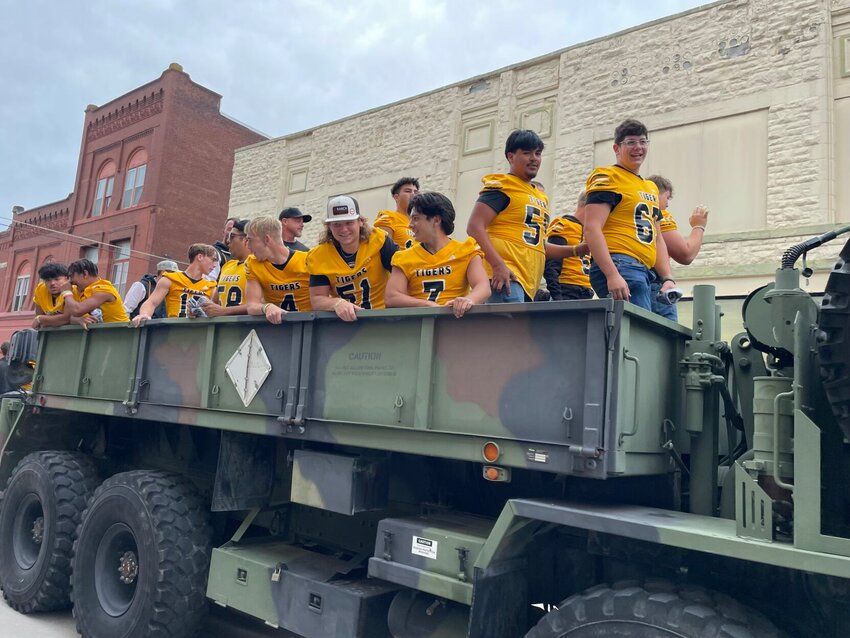 Smith-Cotton football rides in the back of a military cargo truck during the Sedalia 200 Homecoming Parade on Friday, Sept. 27. 


Photo by Chris Howell | Democrat