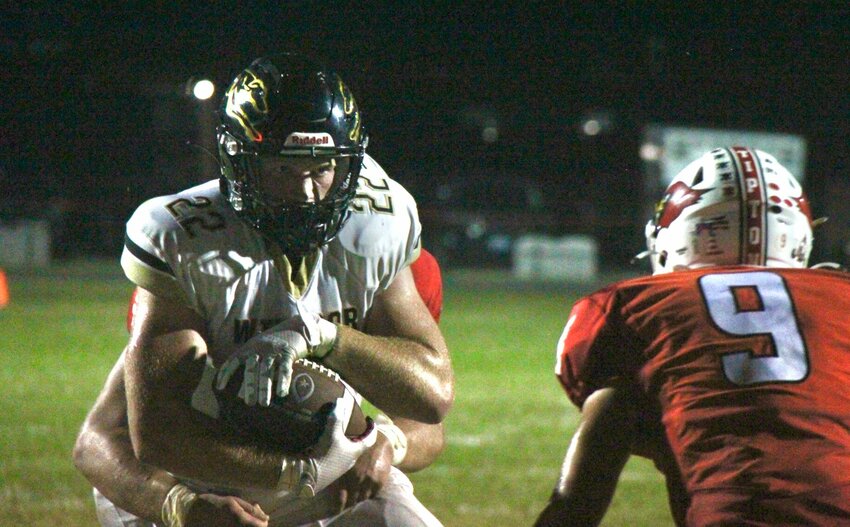 Windsor sophomore Rowan Cox (22) stares down a Tipton defender during the game between the Greyhounds and Cardinals Friday, Sept. 20. Both Windsor and Tipton earned shutout victories Friday, Oct. 4.   File photo by Jack Denebeim | Democrat