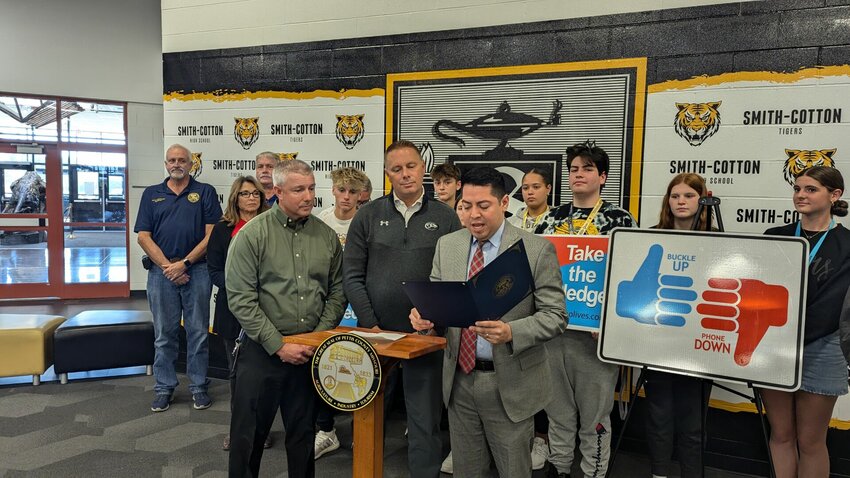 Pettis County Eastern Commissioner Israel Baez reads a proclamation celebrating for Buckle Up Phone Down on Thursday, Oct. 17, at Smith-Cotton High School.


Photo courtesy of the Johnson County Commission 